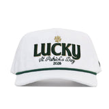 The No Rivals St.Pattys Lucky Cord Hat - White features "LUCKY" in green, a gold shamrock, “St. Patrick’s Day 2026” embroidered below, an unstructured fit, snapback closure, and green brim trim.