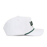 The No Rivals St.Pattys Lucky Cord Hat - White is a white corduroy hat with a green-accented brim and partial green text on the front, shown in side profile against a white background. It features an unstructured fit for casual comfort.