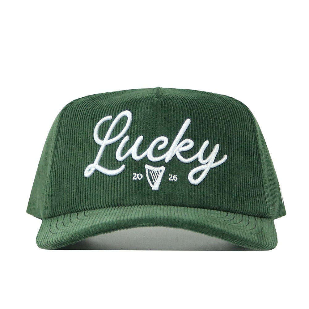 The No Rivals St.Pattys Lucky Cord Hat - Green is an unstructured green corduroy baseball cap featuring “Lucky” in white script, a harp symbol, and the numbers 20 and 26 embroidered on the front.