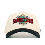 The No Rivals South Carolina Ballpark Hat is a white snapback with "South Carolina GAMECOCKS Est. 1801" embroidered in red, green, and gold on the front, featuring a black curved brim and structured cotton fit.