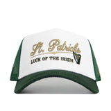 The No Rivals St.Pattys Trucker Hat is a white and green corduroy snapback featuring gold and black embroidery reading "St. Patricks" and "Luck of the Irish," plus a small harp design for festive style and comfort.