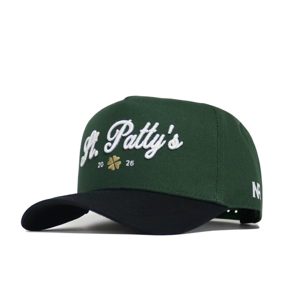 The No Rivals St.Pattys Shamrock Hat features green and black corduroy, "St. Pattys 2026" in white embroidery on the front with a gold shamrock between the numbers, a white NF logo on the side, and an adjustable snap back.