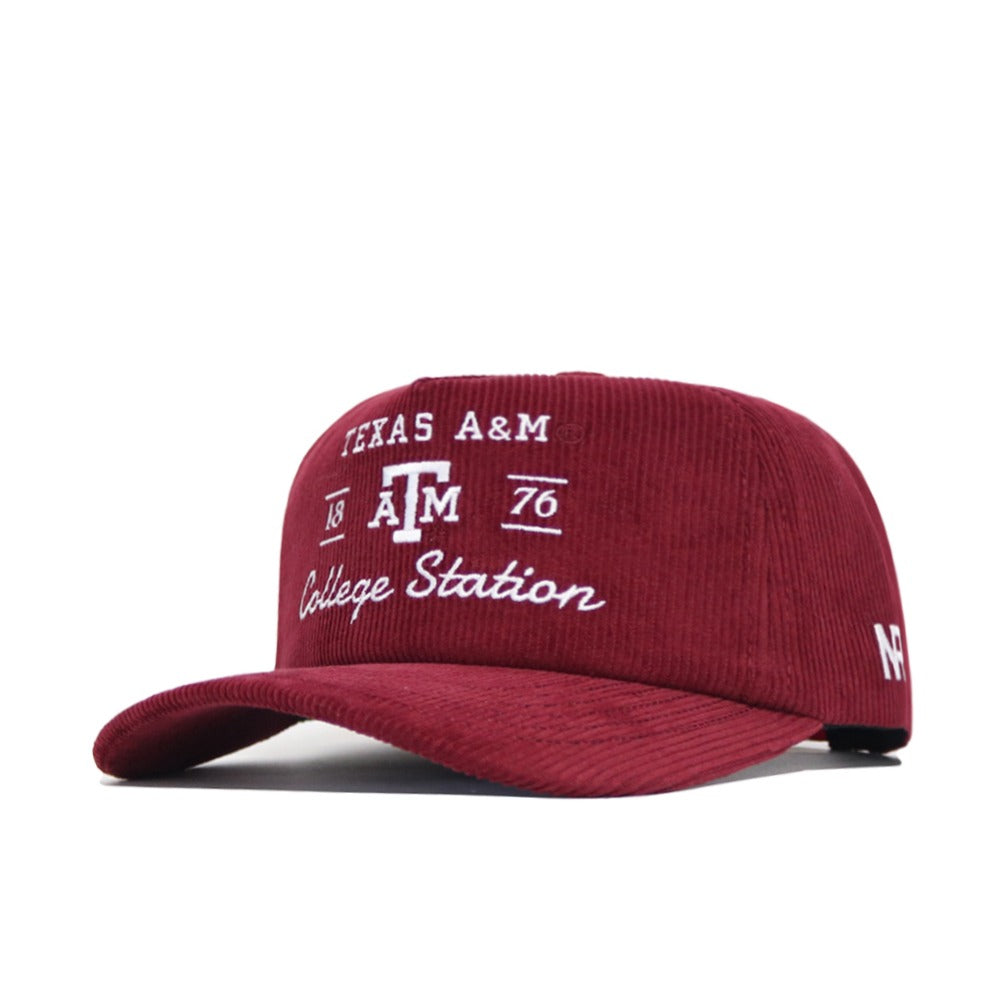 The No Rivals Texas A&M Vintage Cord Hat is maroon corduroy with "Texas A&M College Station 1876" embroidered in white on the front, "A and M" on the side, and features an unstructured fit for casual comfort.