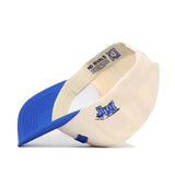 The Upside Down Blue Raiders Hat - Middle Tennessee by No Rivals is a cream and blue cotton baseball cap, shown flipped to reveal the NO RIVALS interior label and a blue embroidered UK logo on the side.