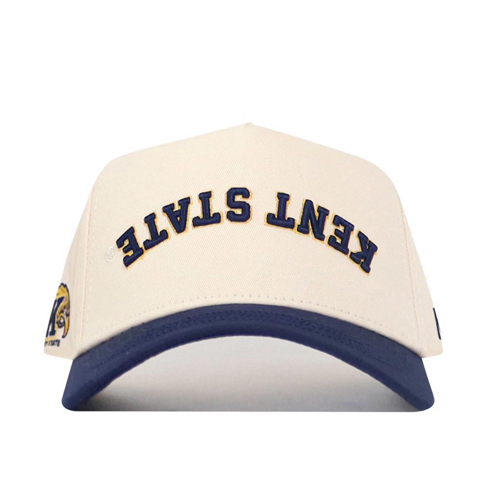 The Upside Down Kent State Hat by No Rivals is a white cotton cap with "KENT STATE" embroidered upside down in navy, a navy brim, yellow and blue logo on the left side, and a structured fit for lasting style.