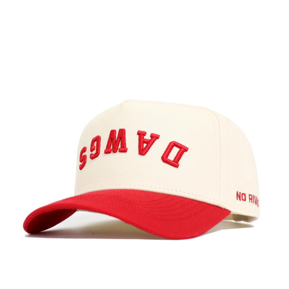 The Upside Down DAWGS Hat - Georgia by No Rivals features classic cream and red, “DAWGS” in red upside down on the front, NO RIV stitched on the brim, and a snapback for a perfect gameday fit.