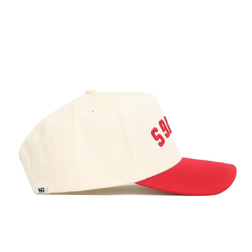 The Upside Down DAWGS Hat - Georgia - Classic Colors by No Rivals features a cream crown, bold red brim, red S9 text on the side, and a small white NR tag on the back—shown here in a side profile, perfect for your Gameday look.