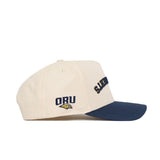 The Upside Down Oral Roberts Hat - Classic Colors by No Rivals features a cream crown, navy brim, "SUMMIT" in navy on the front, and an ORU golden eagle logo on the side. Made from premium cotton with a structured, classic style.