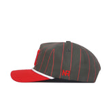 The Nebraska Gray Unstructured Hat by No Rivals features thin red pinstripes, a red flat brim with white accent, and red embroidered NR letters on the side. Made from high-quality cotton with an adjustable snapback closure.