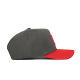 A side view of the No Rivals Nebraska Gray Structured Hat, featuring a dark gray crown and bright red curved brim in premium cotton for a structured fit, displayed against a white background.