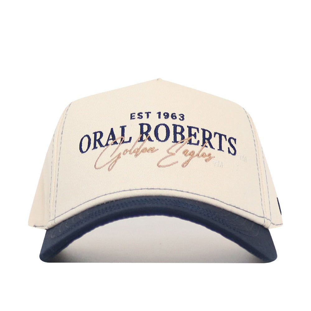 The No Rivals Oral Roberts Vintage Hat is a beige and navy snapback made from high-quality cotton, featuring blue and gold “EST 1963 ORAL ROBERTS Golden Eagles” lettering. Officially licensed—perfect for any fan.