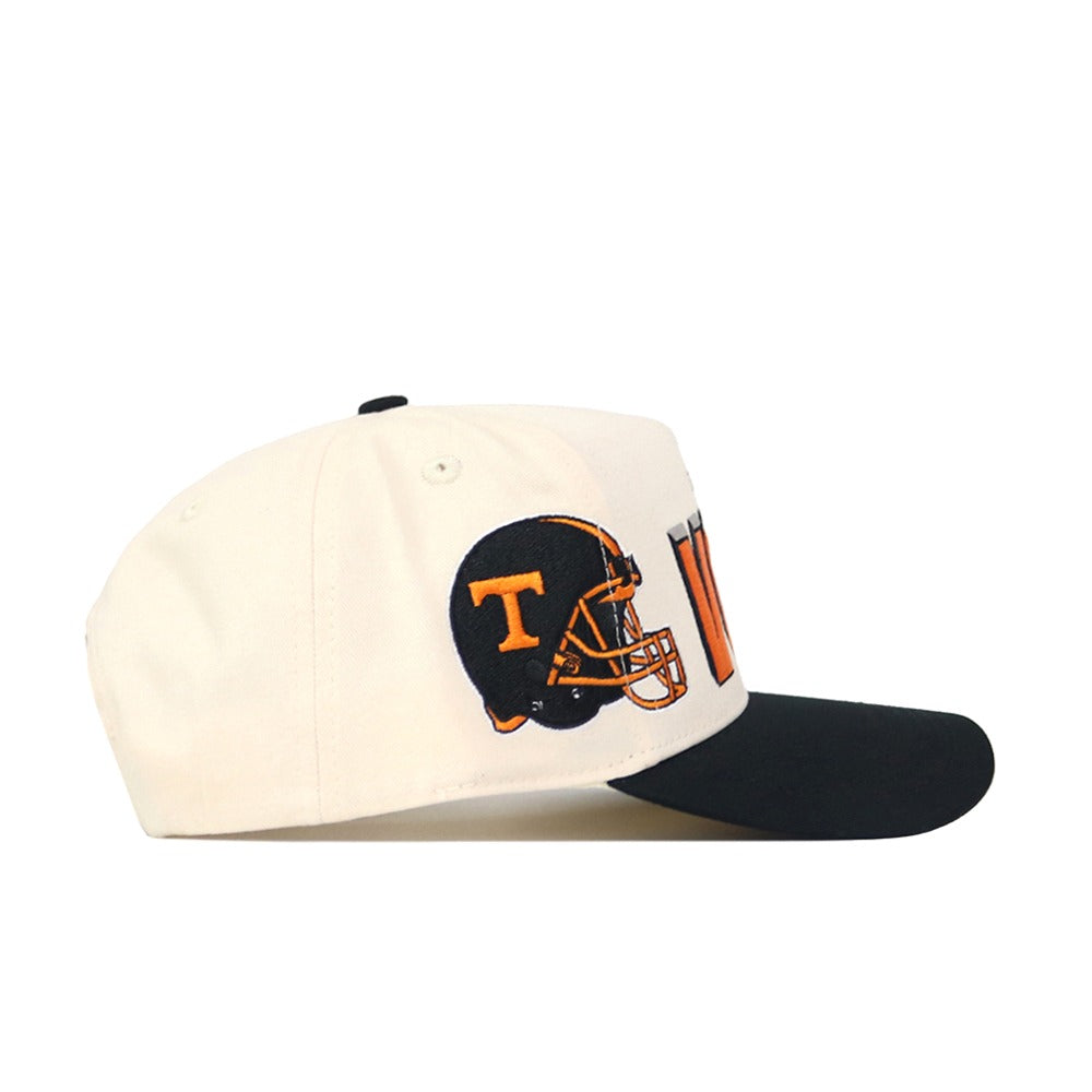 The Tennessee Alma Mater Hat - Blackout by No Rivals is a high-quality cotton cap with a black brim and white crown, featuring an embroidered football helmet with a large orange T. It includes a convenient snap back adjustment.