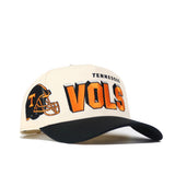 The No Rivals Tennessee Alma Mater Hat - Blackout features a cream and black design with "TENNESSEE VOLS" in orange and black on the front, a football helmet with T logo, and an adjustable snapback for comfort.