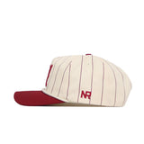 The No Rivals Alabama Pinstripe Hat features cream cotton fabric with thin maroon vertical pinstripes, a maroon brim, snapback closure, and "NR" embroidered in maroon on the side.