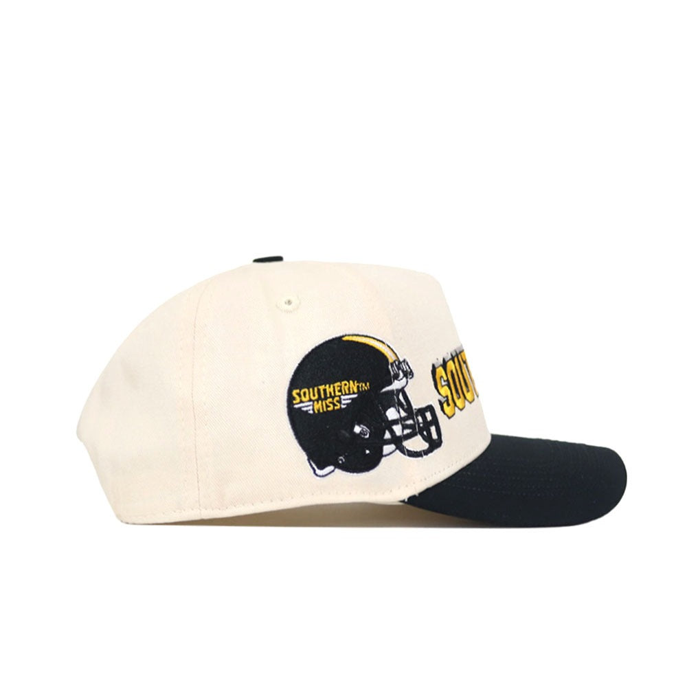 The Southern Miss Alma Mater Hat by No Rivals is a cream-colored snapback with a black brim, black football helmet graphic, and Southern Miss embroidered on the front and side. This officially licensed cap features stylish embroidered logos.