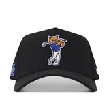The No Rivals Kentucky Golf Hat – Black features an embroidered wildcat swinging a golf club on the front, blue and white logo detail on the side, and a snapback closure for a custom Gameday Fit.