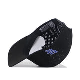 The Kentucky Golf Hat - Black by No Rivals is flipped upside down, revealing its inside lining, ventilation holes, and a white H with blue outline on the side. The inner band says NO RIVALS—a perfect gameday fit.