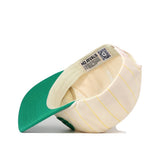 The Oregon Pinstripe Hat by No Rivals features beige and yellow stripes, a green brim, an inside label with the brand name, a QR code by the sweatband, and an adjustable snap back for a custom fit.