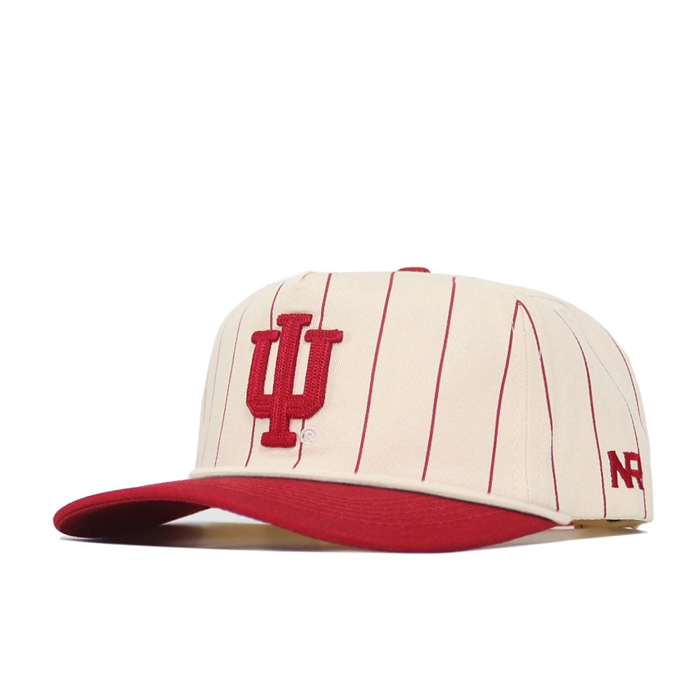 Show your Hoosier pride with the Indiana University Pinstripe Hat by No Rivals. This cream baseball cap features bold red pinstripes, a red brim, and a striking red embroidered IU logo on the front. The iconic No Rivals “NR” initials are embroidered on the side for added detail. Designed with an unstructured fit and adjustable snapback closure, this hat ensures comfort and flexible, one-size-fits-most styling.
