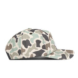Side view of the Alabama Crimson Tide Huntsman Hat by No Rivals, featuring a green, beige, and black camouflage pattern on a white background, crafted from high-quality cotton with an adjustable snap back closure.
