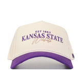 Show your team spirit with the No Rivals Kansas State Wildcats Vintage Hat—a white and purple snapback featuring “EST 1863 KANSAS STATE Wildcats” embroidered on the front in bold purple and gold lettering. Crafted from high-quality cotton, this hat ensures a comfortable, lasting fit that’s perfect for gameday.