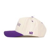 Introducing the Kansas State Wildcats Vintage Hat by No Rivals—a premium cream baseball cap made from high-quality cotton, featuring a striking purple brim and detailed purple embroidery, including the NR lettering on the side. This classic snapback is perfect for elevating your gameday fit.